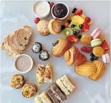  ?? COURTESY OF SAVING THYME ?? Saving Thyme has added takeout afternoon tea kits with sandwiches, quiche, pâté, croissants, macarons, fruit, madeleines and scones.