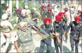  ?? SAMEER SEHGAL / HT PHOTO ?? ▪ Police officers chase away protestors after stones were pelted on them while preparing the resumption of railway services, at Dhobi Ghat near Jaura Fatak in Amritsar on Sunday.