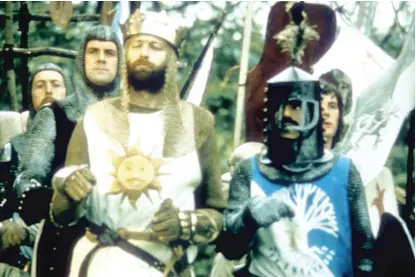  ?? BPI ?? Sir Bedevere (Terry Jones, in helmet) is perhaps the dimmest knight of the Round Table in “Monty Python and the Holy Grail,” which is really saying something.