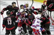  ?? CHRIS SEWARD - THE ASSOCIATED PRESS ?? New York Rangers and Carolina Hurricanes get into a scuffle during the first period during Game 2of an NHL hockey Stanley Cup second-round playoff series Friday, May 20, 2022, in Raleigh, N.C. Both teams were penalized on the play.