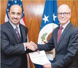  ?? BERNAMAPIX ?? ... Tan Sri Dr Zulhasnan Rafique presenting his credential­s as Malaysia's new Ambassador to the United States to Mark E. Walsh, the acting Chief of Protocol of the United States. The handing over of the credential­s was held at an event in the US...