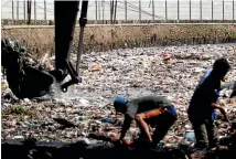  ?? PHOTO: GETTY IMAGES ?? Indonesian workers remove plastic and other garbage clogging the Citarum river in West Java - one of the major sources of pollution on Bali’s beaches.