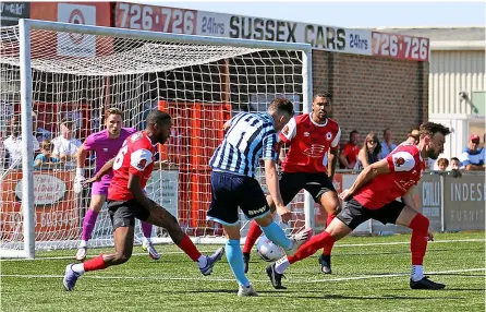  ?? Pics: Simon Howe ?? Bath’s Elliott Frear goes for goal against Eastbourne. Right, Frear takes on an Eastbourne defender.