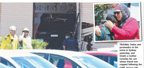  ?? Pictures: AAP ?? TRAUMA: Police and paramedics at the scene in Sydney yesterday; and (inset) a mother consoles her son whose friend was trapped following the crash.