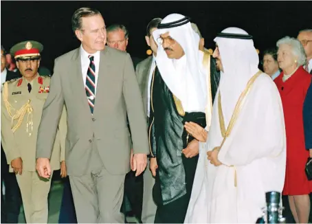  ?? Late Saudi King Fahd receives former US President George H. W. Bush and the First Lady Barbara Bush during their visit to the Kingdom in 1990. ??