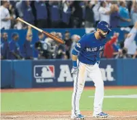  ?? STEVE RUSSELL TORONTO STAR FILE PHOTO ?? Slugger Jose Bautista tosses his bat against the Texas Rangers in 2015, one of the most famous moments in Blue Jays history.