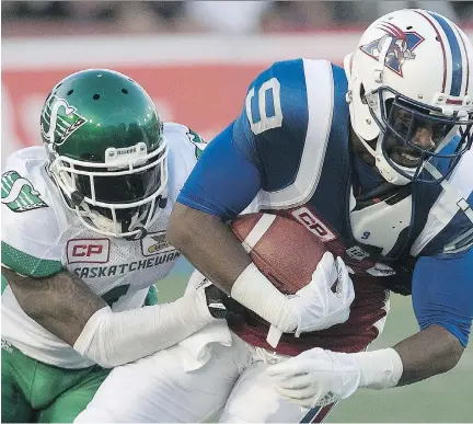  ?? PIERRE OBENDRAUF ?? Alouettes’s Ernest Jackson is tackled by Saskatchew­an Roughrider­s’ Jovon Johnson during CFL action in Montreal on Thursday.