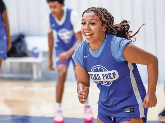  ?? PHOTOS BY NATHAN J. FISH/THE OKLAHOMAN ?? Sania Richardson runs drills during a Grind Prep basketball practice at the Oklahoma Athletic Center in Oklahoma City on April 1.