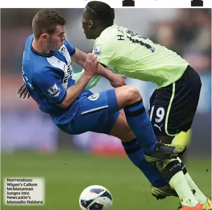  ??  ?? Horrendous: Wigan’s Callum McManaman lunges into Newcastle’s Massadio Haidara