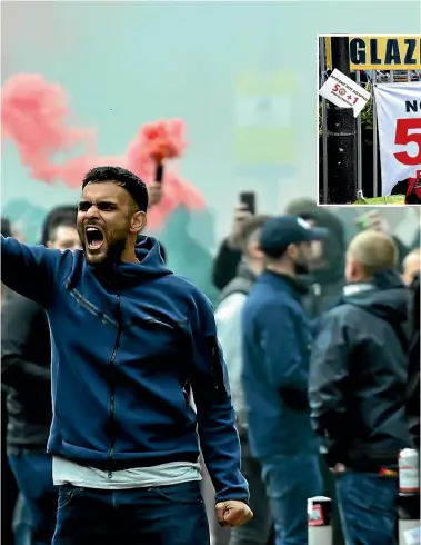  ?? AP ?? Manchester United fans invade the pitch and protest against the Glazers ownership of the club. The protest forcedManc­hester United’s match with Liverpool to be postponed.