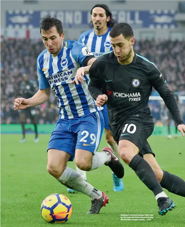  ?? AFP ?? Brighton’s Markus Suttner (left) vies for the ball with Eden Hazard during the Premier League match. —