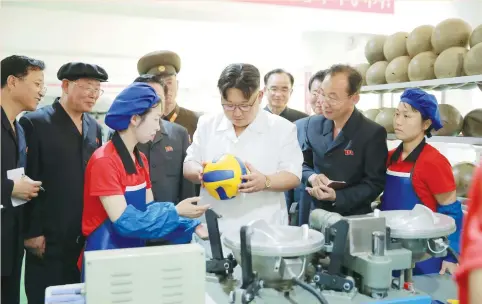  ?? (KCNA/via Reuters) ?? NORTH KOREAN leader Kim Jong Un visits a newly built sporting-goods factory in Pyongyang in a photo released by North Korea’s Korean Central News Agency (KCNA) in June. Once reliant on a Soviet-style centrally planned economy, North Korea is now home...