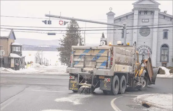  ?? Mike Lynch / Adirondack Explorer ?? A truck spreads salt on a highway in the Adirondack­s. A state study of road salt pollution was amended to keep data from becoming public.