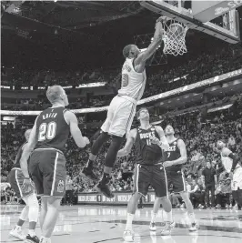  ?? D.A. VARELA dvarela@miamiheral­d.com ?? Heat center Bam Adebayo dunks over the Bucks’ Brook Lopez during Miami’s victory on Saturday. Adebayo finished with 20 points and 13 rebounds in 31 minutes.