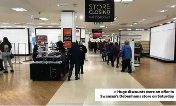  ??  ?? > Huge discounts were on offer in Swansea’s Debenhams store on Saturday