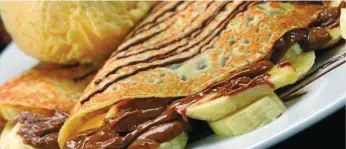  ?? PHOTOS: FILE ?? DESSERT CHOICES: Residents are spoilt for choice when it comes to dining out for dessert. A sweet banana praline crepe from Max Brenner is one of the tempting dishes on offer.