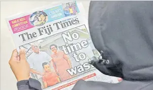  ?? Picture: JONACANI LALAKOBAU ?? An ardent reader reads through the front page of The Fiji Times. A writer
says this newspaper had remained true to its original goals