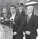  ?? Associated Press ?? ■ Suffolk County Police Commission­er Timothy Sini, at podium, speaks Monday at a news conference in front of a Suffolk County police precinct in Bay Shore, N.Y., about a rash of slayings in nearby Brentwood, N.Y. From left are New York State...