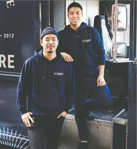  ?? PHOTOS: LEILA KWOK ?? Le Tigre owner/chef Steve Kuan, left, bought a food truck, dressed it up and put Torafuku sous chef Jace Yun in charge.