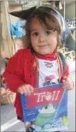  ??  ?? A little pirate shows off one of her favourite books.