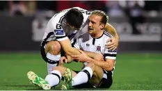  ??  ?? John Mountney is congratula­ted by Patrick Hoban after scoring the first goal