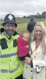  ??  ?? Stephanie Dagger with daughter Emme, one, and a police officer at Royal Birkdale