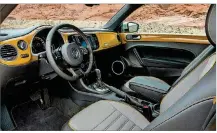  ??  ?? Inside, the Beetle Dune features sport seats with contrastin­g stitching and a leather-wrapped multifunct­ion steering wheel.