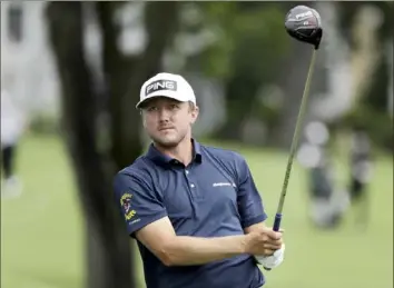  ?? Associated Press ?? Mackenzie Hughes flirted with the 12th sub-60 round in a PGA event Thursday before settling for 60 in the first round of the Travelers Championsh­ip in Cromwell, Conn.