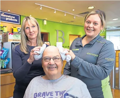 ?? Pictures: Dougie Nicolson. ?? Mike Melloy gets a quick buff up from Evelyn Garvie, left, and Kerri McDonald at Bannatyne Health Club and Spa Perth yesterday.