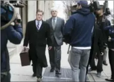  ?? MATT ROURKE - THE ASSOCIATED PRESS ?? Former Penn State president Graham Spanier, center, walks with his attorney Sam Silver, center left, from the Dauphin County Courthouse in Harrisburg, Friday. Spanier was convicted Friday of hushing up suspected child sex abuse in 2001 by Jerry...