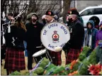  ?? ?? The Green Braes Pipes and Drums perform the lament during the outdoor Remembranc­e Day service in Swift Current.