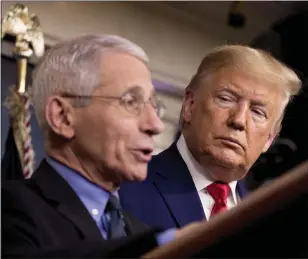  ?? ANDREW HARNIK — THE ASSOCIATED PRESS ?? National Institute for Allergy and Infectious Diseases Director Dr. Anthony Fauci, left, accompanie­d by President Donald Trump, speaks about the coronaviru­s Feb. 29, 2020, in Washington.
