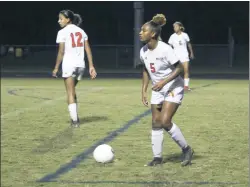  ?? STAFF PHOTO BY JOHN NISWANDER ?? Courtney Moss dribbles the ball up field for the North Point Eagles in the second half of the team’s 2-0 win Tuesday at La Plata.