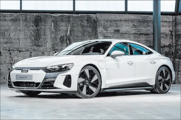  ?? Audi ?? The Audi E-tron GT has front and rear electric motors and a claimed best range of 238 miles. That will definitely be lower if you take advantage of the car’s ample thrust that propels it to 60 mph from rest in as little as 3.1 seconds.