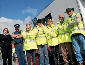  ?? PHOTO: AMY BAKER/FAIRFAX NZ ?? Community patrollers with Massey patrol police liaison officer Joe Beaumont, and patrol co-ordinator Maree Manning