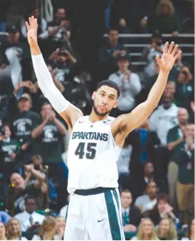  ?? | AL GOLDIS/AP ?? Michigan State star Denzel Valentine acknowledg­es the applause of the crowd as he leaves his final home game Saturday against Ohio State.