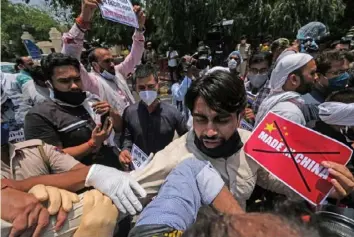  ?? T. Narayan ?? Activists shout slogans during a protest outside the Chinese Embassy in New Delhi, in June.