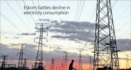  ?? PHOTO: REUTERS ?? A man walks below electricit­y pylons in Soweto. Eskom has encouraged customers to increase consumptio­n and take advantage of the present excess capacity.