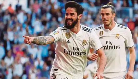  ?? REUTERS PIC ?? Isco celebrates after scoring the opening goal for Real Madrid against Celta Vigo on Saturday. Real won 2-0.