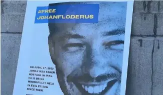  ?? ?? A  che de Johan Floderus lors d'une manifestat­ion à Bruxelles pour demander sa libération