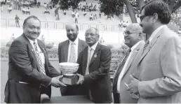  ??  ?? Hyderabad Race Club steward K. Bhupal Reddy ( right) presents the S. Malakonda Reddy Memorial Cup ( Division I) 1200m to K. Rajeshwar Bhupal after Decathlon won on Friday.