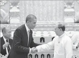  ?? MANDEL NGAN
AFP/Getty Images ?? PRESIDENT OBAMA shakes hands with Myanmar’s President Thein Sein after a meeting at the Presidenti­al Palace in Naypyidaw, Myanmar, in 2014.