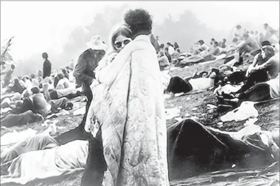  ?? Burk Uzzle Michael Ochs Archives / Getty Images ?? BOBBI AND NICK ERCOLINE, observed at the festival in a photo used for the cover of the “Woodstock” documentar­y soundtrack album, are happily married.
