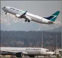  ?? The Associated Press ?? A Westjet flight bound for Palm Springs takes off at Vancouver Internatio­nal Airport, in Richmond, B.C.