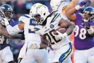  ?? AP FILE ?? Melvin Gordon, one of the league’s premier running backs, is holding out until he gets a contract extension from the LA Chargers.