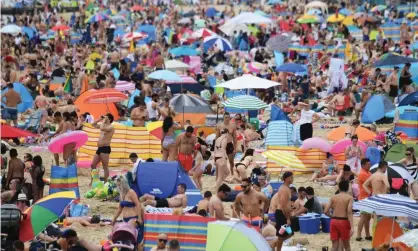  ?? Photograph: Neil Hall/EPA ?? Overcrowdi­ng on Bournemout­h beach during the heatwave. ‘Tourist destinatio­ns are struggling tocope with the influx of new visitors due to warm weather as well as Covid-19 travel restrictio­ns.’
