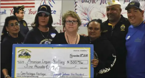  ??  ?? The Imperial Valley Chargers Fan Club kicked in $500 to help defray the costs of sending the care packages overseas. Pictured, from left, are club Secretary Gloria Granillo, club Vice President Jeannette Johnson, American Legion Auxiliary Unit 25 President Dawn Rascoe, club member Kelli Holmes, American Legion District 30 Cmdr. Tracy Rascoe, and El Centro City Councilman Jason Jackson. PHOTO TOM BODUS Continued from A1