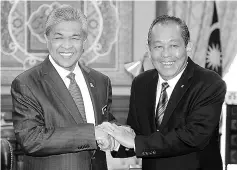  ??  ?? Datuk Seri Dr Ahmad Zahid Hamidi (left), with Vietnamese counterpar­t Truong Hoa Binh. - Bernama photo