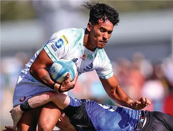  ?? Photo: Fijian Drua Media ?? Swire Shipping Fijian Drua first five eighth Isaiah Armstrong-Ravula (with ball) attempts to escape a tackle by Blues halfback Finlay Christie during their Super Rugby Pacific opening match at Semenoff Stadium, Whangarei, Auckland, New Zealand on February 24, 2024.
