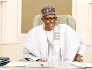  ??  ?? Nigeria’s President Muhammadu Buhari smiles as he resumes work following seven weeks of medical leave, in Abuja on Monday. (Reuters)